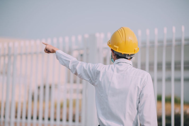 Rear view of man working