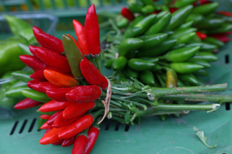 High angle view of chili peppers at market stall
