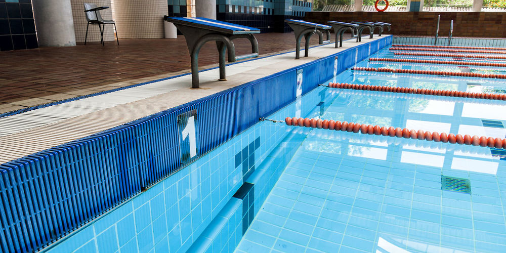 Starting block by swimming pool
