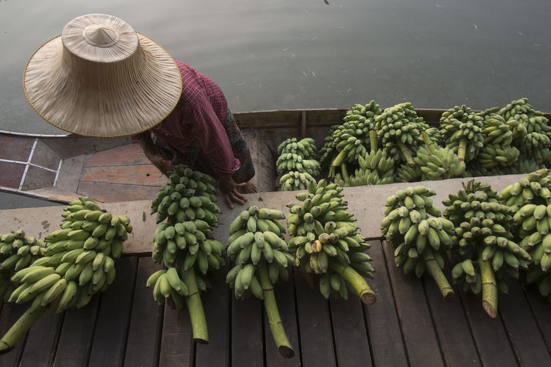 High angle view of vendor selling banana at floating market