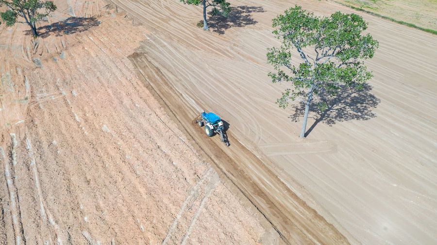High angle view of man riding bicycle on road