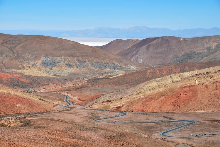 Winding road towards salinas grandes high up in the andes of argentina