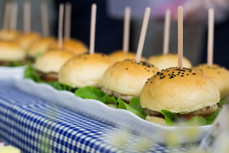 Close-up of burgers served on table