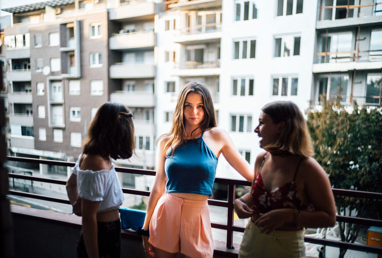 Women and woman in city