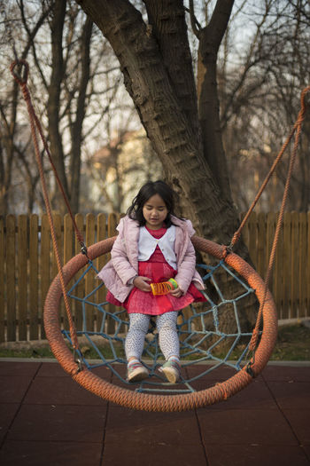 Full length of girl in playground at park
