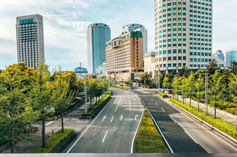 Street amidst buildings against sky