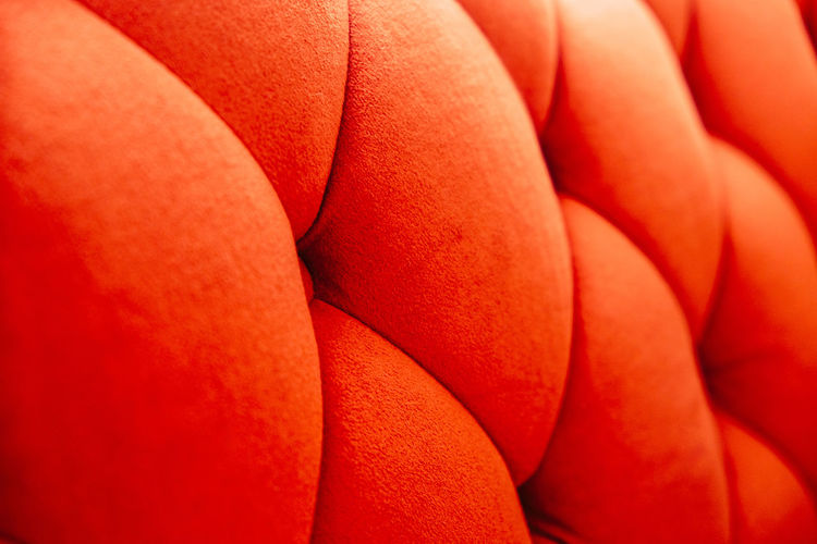 Background of orange velvet sofa