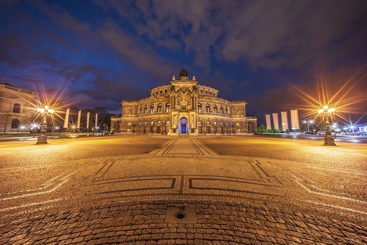 Low angle view of illuminated street at night