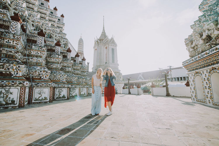 Happy women at temple in city