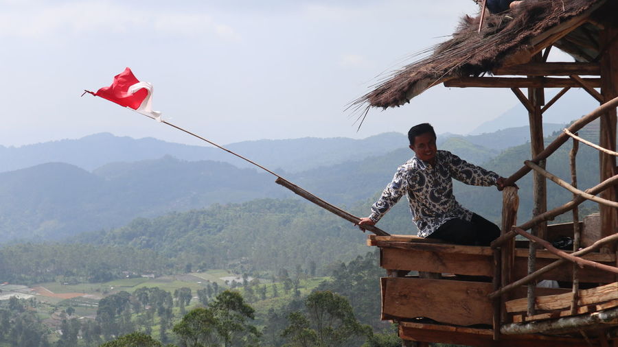 Man holding indonesian flag
