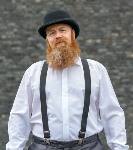 Bearded mature man wearing hat outdoors