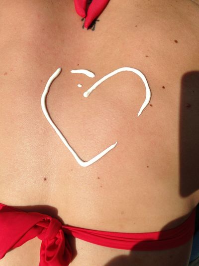 Close-up of suntan lotion on back