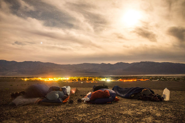 Group of people sleeping on landscape