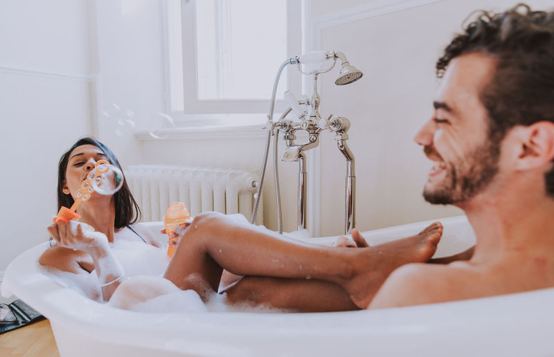 Couple sitting in bathtub