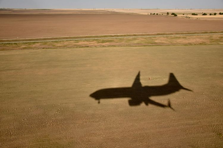 Shadow of a airplane on landscape