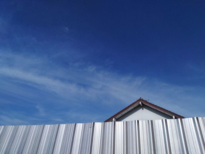 Low angle view of wooden house against sky