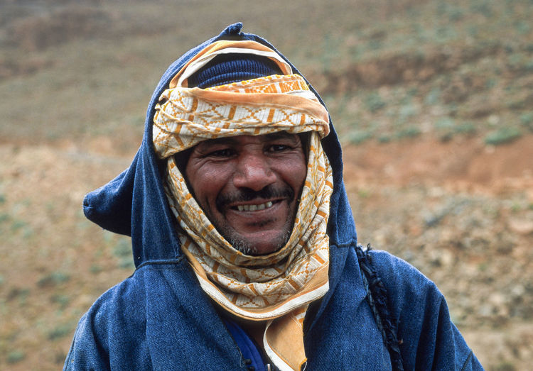 Portrait of smiling man standing outdoors