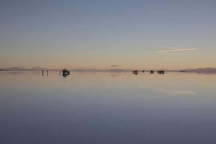 Cars over water in uyuni salar