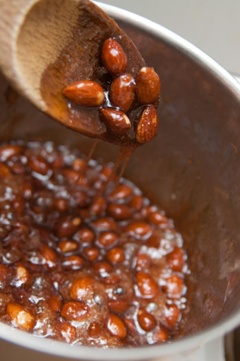 Close-up of roasted almonds in container