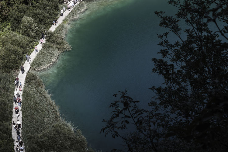 High angle view of people walking on boardwalk at plitvice lakes national park