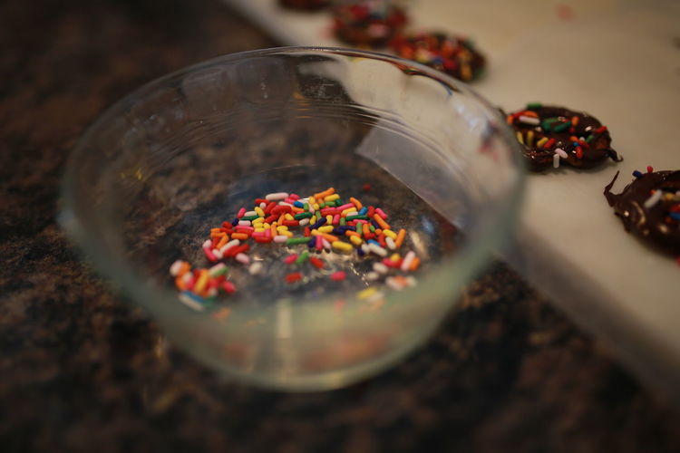 High angle view of sprinkles in bowl on table