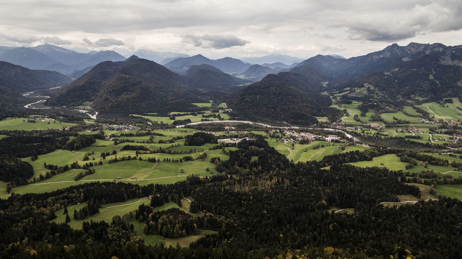 Scenic view of landscape and mountains against sky
