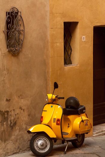 Parked scooter against the wall