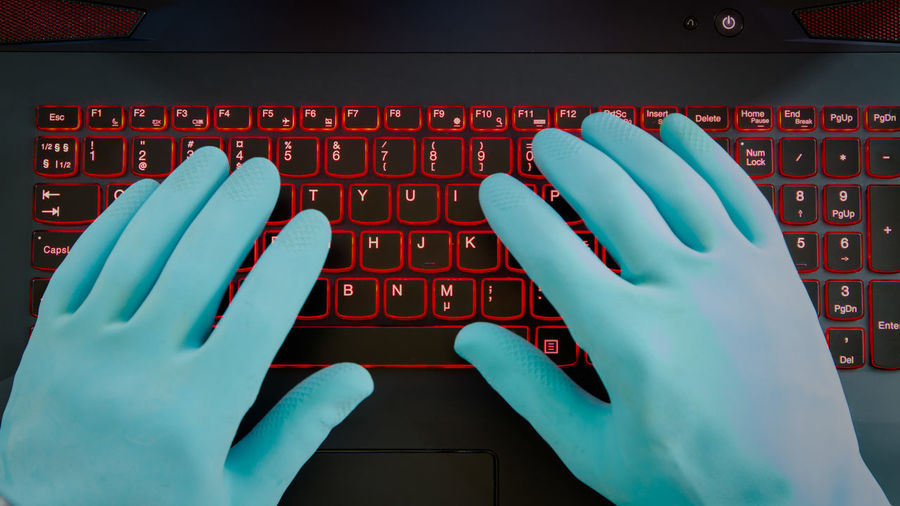 Close-up of hand using laptop