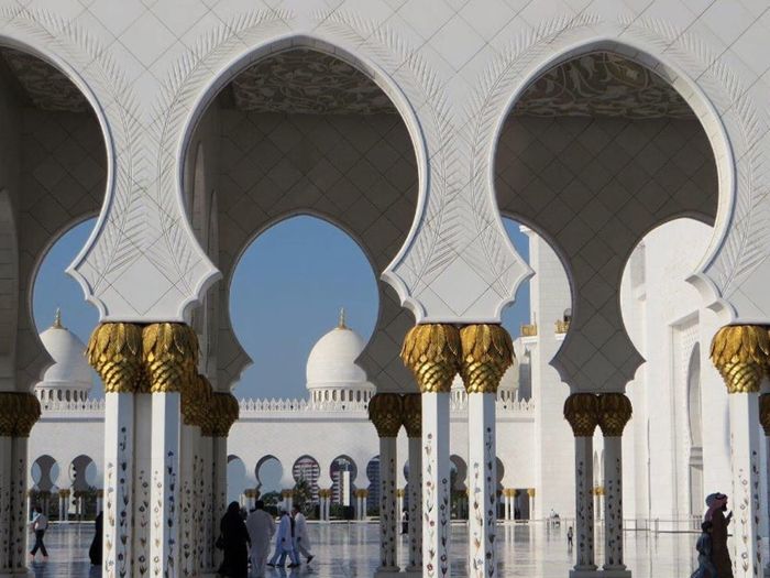 Exterior of mosque against clear blue sky