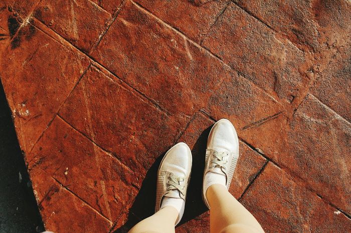 Woman's legs on cobblestones