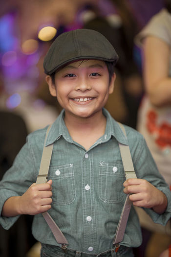 Portrait of smiling boy standing in ceremony