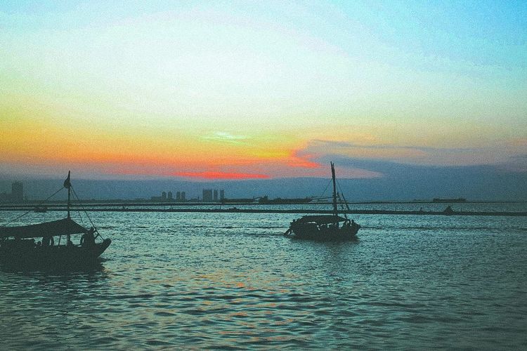 Scenic view of sea at sunset