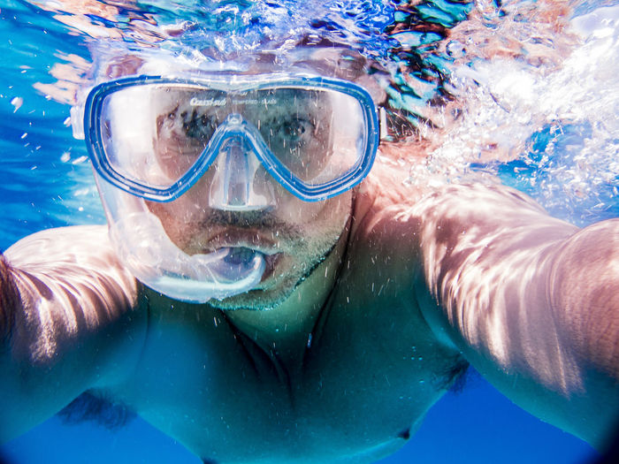 Portrait of young man in underwater