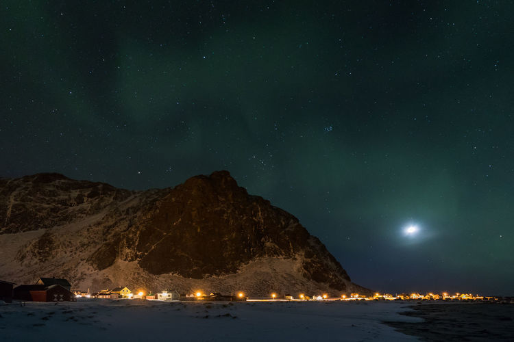 Scenic view of mountain against sky at night