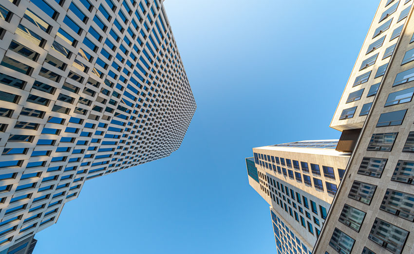 Low angle view of modern buildings against sky 