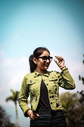Fashionable woman wearing eyeglasses looking away outdoors