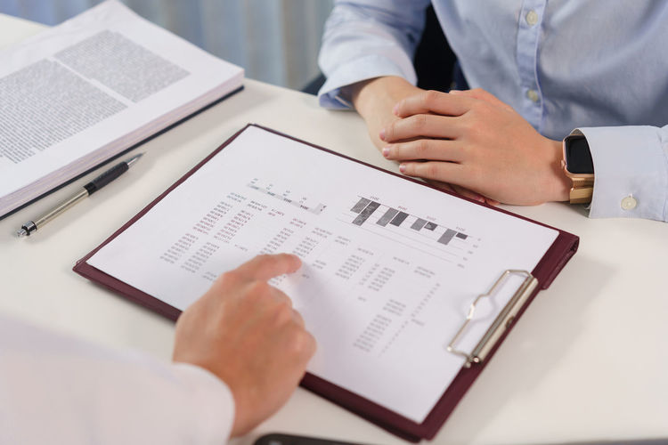 Midsection of man working in office