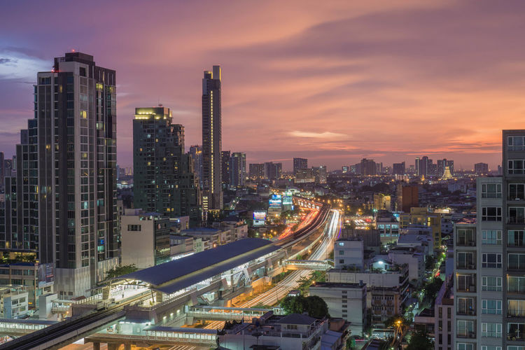 High angle view of illuminated buildings against sky during sunset