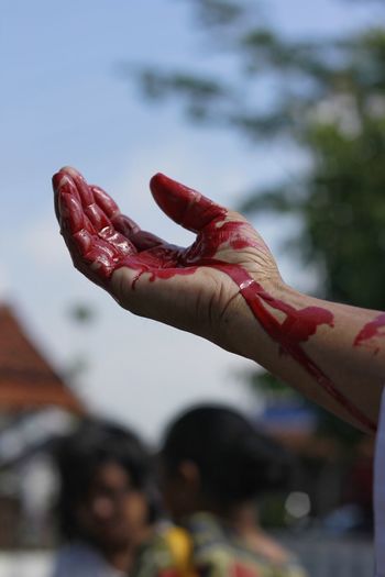 Close-up of hand with blood