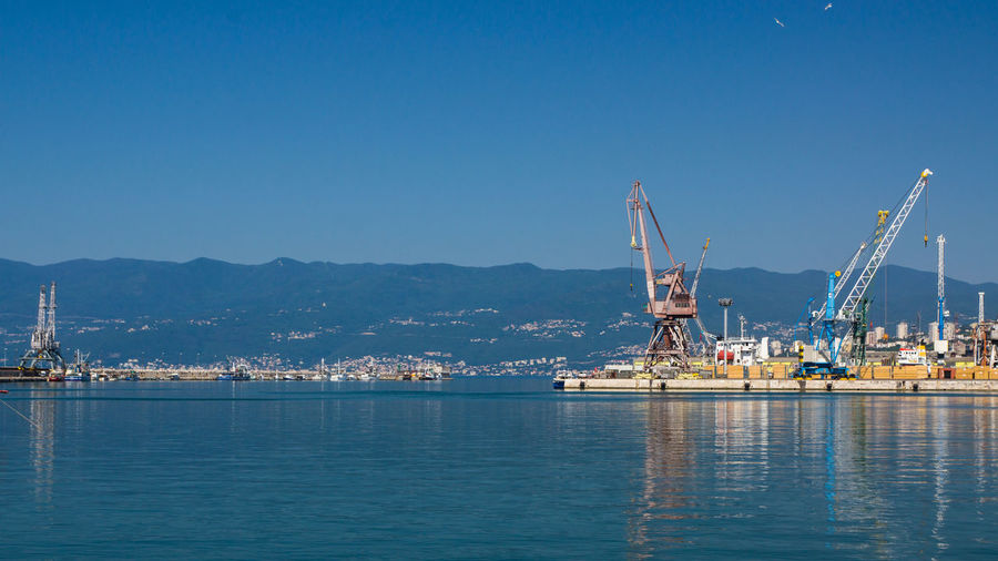 Port cranes in the port of rijeka. a rather quiet scene.