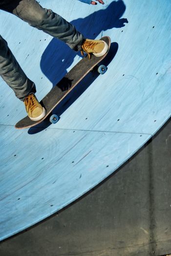 Low section of man skateboarding at park