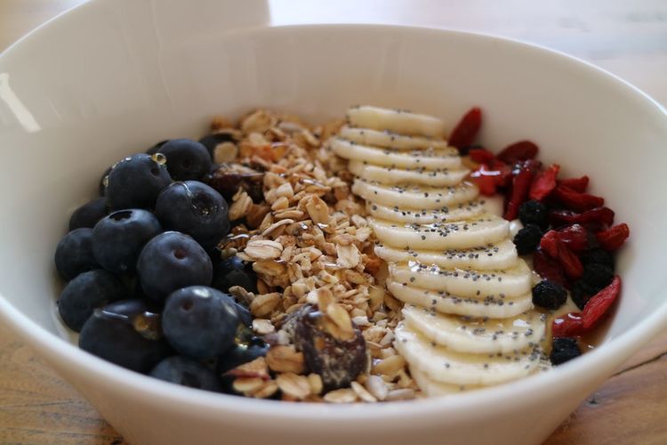 Close-up of fruit slices and muesli in bowl