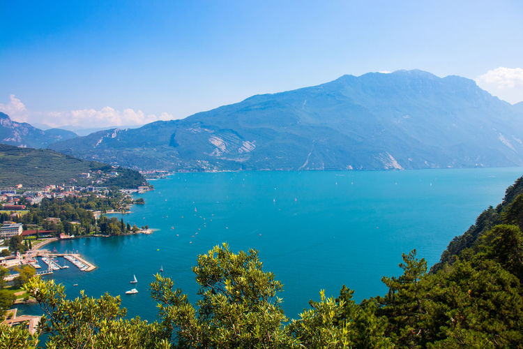 Scenic view of lake and mountains against sky