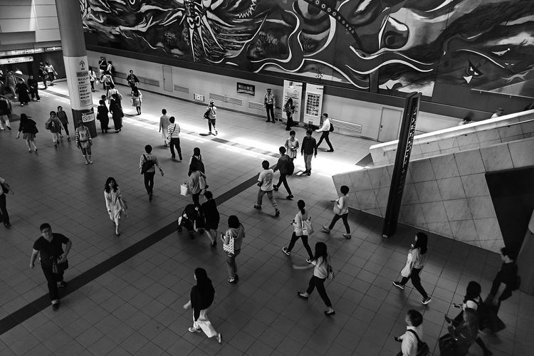 High angle view of people walking at shibuya station