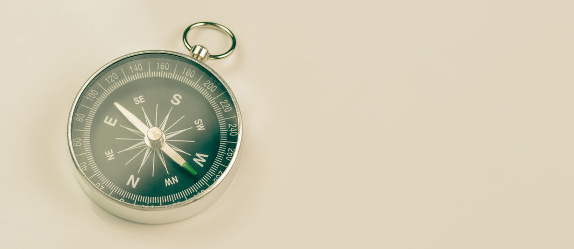 Close-up of clock over white background