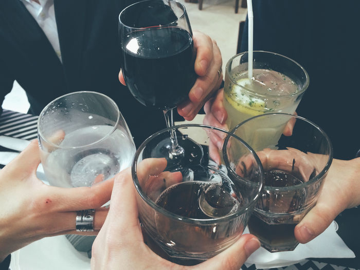 Cropped image of hands holding drink