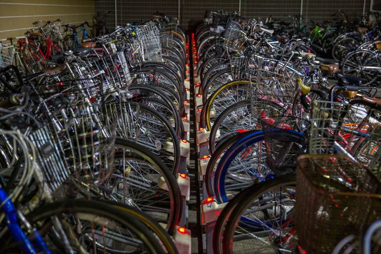 Stack of bicycles in parking lot