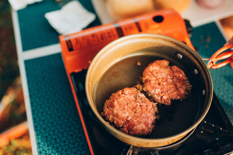 High angle view of meat in cooking pan on table