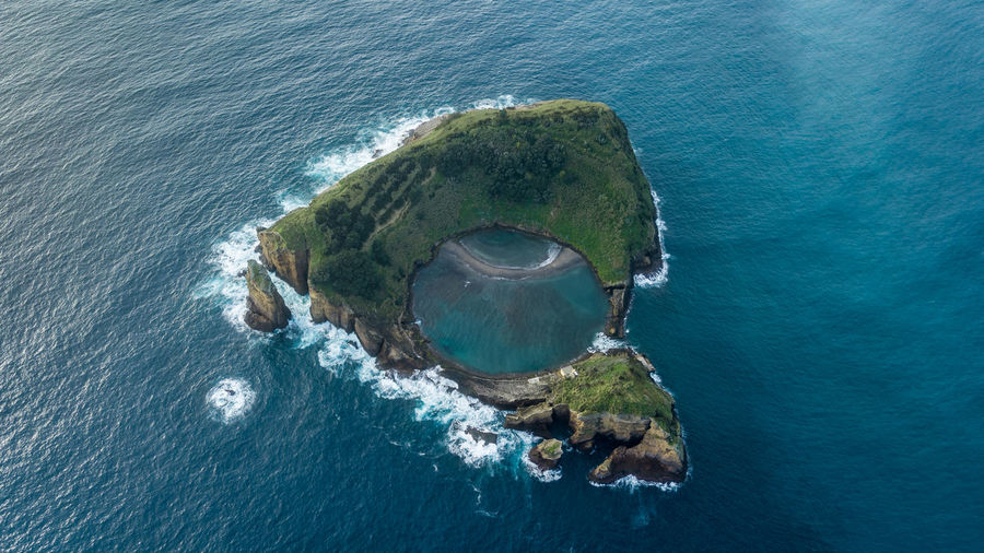 High angle view of rock in sea