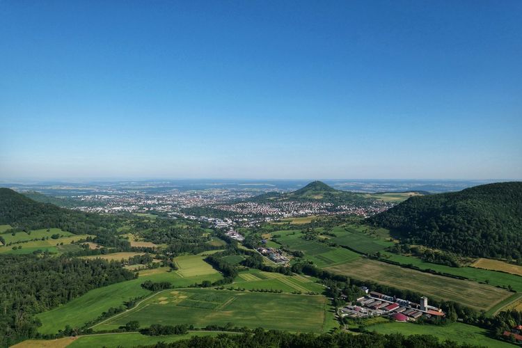 High angle view of landscape against blue sky